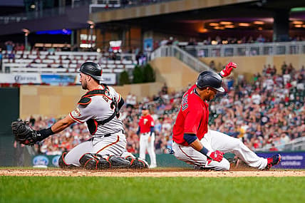Aug 26, 2022; Minneapolis, Minnesota, USA; Minnesota Twins second baseman Jorge Polanco (11) slides home against the San Francisco Giants in the third inning at Target Field. Mandatory Credit: Brad Rempel-USA TODAY Sports