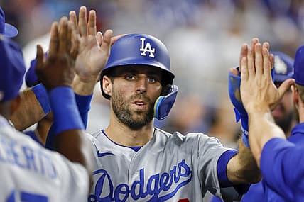 Aug 26, 2022; Miami, Florida, USA; Los Angeles Dodgers second baseman Chris Taylor (3) celebrates after scoring during the tenth inning against the Miami Marlins at loanDepot Park. Mandatory Credit: Sam Navarro-USA TODAY Sports