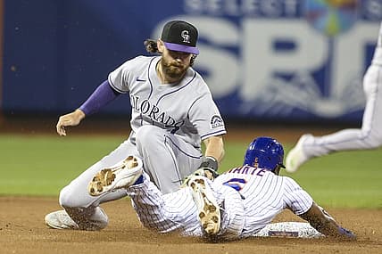 Aug 27, 2022; New York City, New York, USA;  Colorado Rockies second baseman Brendan Rodgers (7) tags out New York Mets right fielder Starling Marte (6) in the third inning at Citi Field. Mandatory Credit: Wendell Cruz-USA TODAY Sports