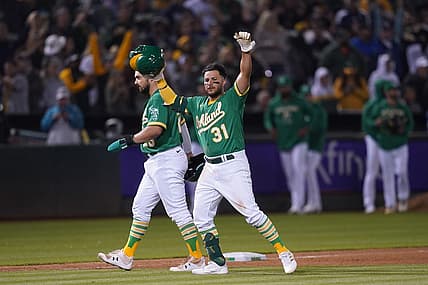 Aug 27, 2022; Oakland, California, USA; Oakland Athletics third baseman Vimael Machin (31) celebrates after defeating the New York Yankees in eleven innings at RingCentral Coliseum. Mandatory Credit: Cary Edmondson-USA TODAY Sports