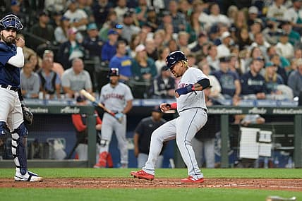 Aug 27, 2022; Seattle, Washington, USA; Cleveland Guardians third baseman Jose Ramirez (11) scores a run on a sacrifice fly hit by second baseman Andres Gimenez (not pictured) against the Seattle Mariners during the eighth inning at T-Mobile Park. Mandatory Credit: Steven Bisig-USA TODAY Sports