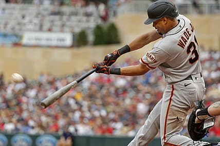 Aug 28, 2022; Minneapolis, Minnesota, USA; San Francisco Giants right fielder LaMonte Wade (31) hits an RBI ground-rule double against the Minnesota Twins in the third inning at Target Field. Mandatory Credit: Bruce Kluckhohn-USA TODAY Sports