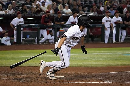 Aug 29, 2022; Phoenix, Arizona, USA; Arizona Diamondbacks right fielder Corbin Carroll (7) hits a two RBI double against the Philadelphia Phillies during the fifth inning at Chase Field. Mandatory Credit: Joe Camporeale-USA TODAY Sports