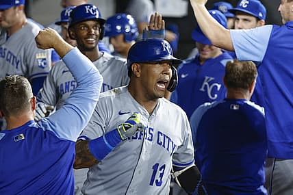 Aug 30, 2022; Chicago, Illinois, USA; Kansas City Royals catcher Salvador Perez (13) celebrates with teammates after hitting a two-run home run against the Chicago White Sox during the third inning at Guaranteed Rate Field. Mandatory Credit: Kamil Krzaczynski-USA TODAY Sports