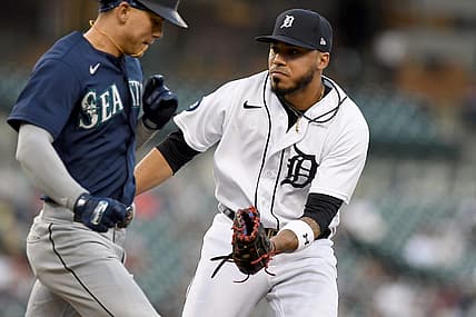 Aug 31, 2022; Detroit, Michigan, USA; Detroit Tigers first baseman Harold Castro (right) tags out Seattle Mariners left fielder Sam Haggerty (0) after a bunt attempt in the second inning at Comerica Park. Mandatory Credit: Lon Horwedel-USA TODAY Sports
