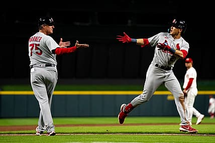 St. Louis Cardinals right fielder Lars Nootbaar (21) celebrates with St. Louis Cardinals third base coach Ron 'Pop' Warner (75) after hitting a 2-run home run in the thirteenth inning of the MLB game between between the Cincinnati Reds and the St. Louis Cardinals at Great American Ball Park in Cincinnati, Wednesday, Aug. 31, 2022.

St Louis Cardinals At Cincinnati Reds