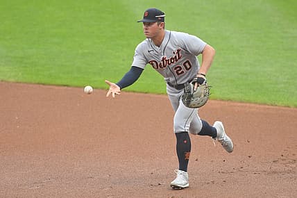 Jul 16, 2022; Cleveland, Ohio, USA; Detroit Tigers first baseman Spencer Torkelson (20) tosses the ball to first base in the first inning against the Cleveland Guardians at Progressive Field. Mandatory Credit: David Richard-USA TODAY Sports