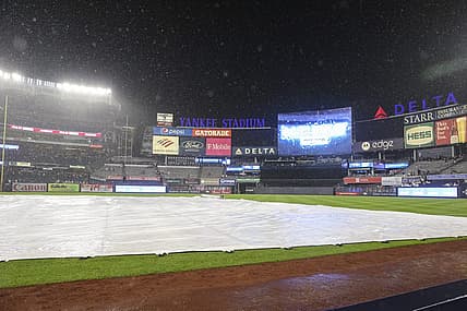 Jul 29, 2022; Bronx, New York, USA;  A rain delay is called in the game between the Kansas City Royals and the New York Yankees after the bottom of the seventh inning at Yankee Stadium. Mandatory Credit: Wendell Cruz-USA TODAY Sports