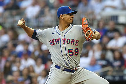 Aug 15, 2022; Atlanta, Georgia, USA; New York Mets starting pitcher Carlos Carrasco (59) throws against the Atlanta Braves in the first inning at Truist Park. Mandatory Credit: Brett Davis-USA TODAY Sports