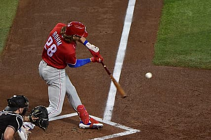 Aug 31, 2022; Phoenix, Arizona, USA;  Philadelphia Phillies third baseman Alec Bohm (28) hits an RBI single in the first inning against the Arizona Diamondbacks at Chase Field. Mandatory Credit: Matt Kartozian-USA TODAY Sports