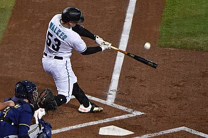 Sep 1, 2022; Phoenix, Arizona, USA; Arizona Diamondbacks first baseman Christian Walker (53) hits a two run home run in the first inning against the Milwaukee Brewers at Chase Field. Mandatory Credit: Matt Kartozian-USA TODAY Sports