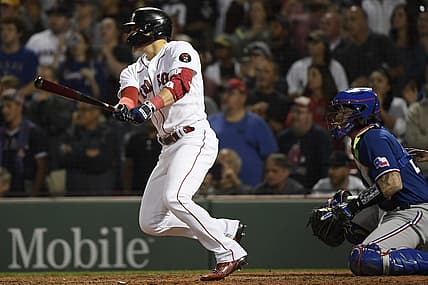 Sep 1, 2022; Boston, Massachusetts, USA; Boston Red Sox second baseman Enrique Hernandez (5) hits a Rbi single during the ninth inning against the Texas Rangers at Fenway Park. Mandatory Credit: Bob DeChiara-USA TODAY Sports