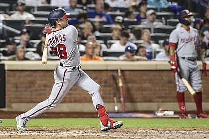 Sep 3, 2022; New York City, New York, USA; Washington Nationals center fielder Lane Thomas (28) hits a solo home run in the eighth inning against the New York Mets at Citi Field. Mandatory Credit: Wendell Cruz-USA TODAY Sports