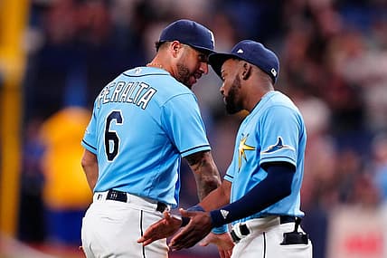 Sep 3, 2022; St. Petersburg, Florida, USA; Tampa Bay Rays left fielder David Peralta (6) and second baseman Vidal Brujan (7) celebrate after winning against the New York Yankees at Tropicana Field. Mandatory Credit: Rich Storry-USA TODAY Sports