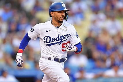 Sep 3, 2022; Los Angeles, California, USA; Los Angeles Dodgers second baseman Mookie Betts (50) runs after hitting a triple against the San Diego Padres during the first inning  at Dodger Stadium. Mandatory Credit: Gary A. Vasquez-USA TODAY Sports
