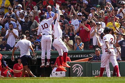 Sep 4, 2022; Boston, Massachusetts, USA; Boston Red Sox center fielder Enrique Hernandez (5) hi fives second baseman Trevor Story (10) for hitting a three-run home run against the Texas Rangers during the first inning at Fenway Park. Mandatory Credit: Gregory Fisher-USA TODAY Sports