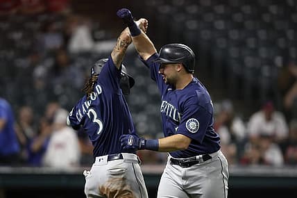 Sep 4, 2022; Cleveland, Ohio, USA; Seattle Mariners catcher Cal Raleigh (29) celebrates with short stop J.P. Crawford (3) after hitting a two run home run against the Cleveland Guardians in the eleventh inning at Progressive Field. Mandatory Credit: Aaron Josefczyk-USA TODAY Sports