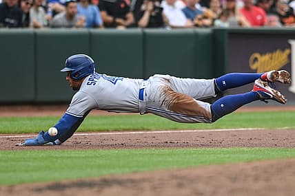 Sep 5, 2022; Baltimore, Maryland, USA;  Toronto Blue Jays center fielder George Springer (4) slides into third base before the throw during the third inning against the Baltimore Orioles at Oriole Park at Camden Yards. Mandatory Credit: Tommy Gilligan-USA TODAY Sports
