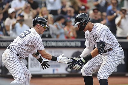 Sep 5, 2022; Bronx, New York, USA;  New York Yankees center fielder Aaron Judge (99) is greeted by New York Yankees third baseman Josh Donaldson (28) after hitting a two run home run in the sixth inning against the Minnesota Twins at Yankee Stadium. Mandatory Credit: Wendell Cruz-USA TODAY Sports