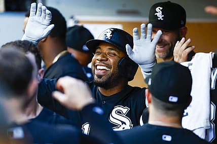 Sep 5, 2022; Seattle, Washington, USA; Chicago White Sox shortstop Elvis Andrus (1) high-fives teammates in the dugout after hitting a two-run home run against the Seattle Mariners during the third inning at T-Mobile Park. Mandatory Credit: Joe Nicholson-USA TODAY Sports