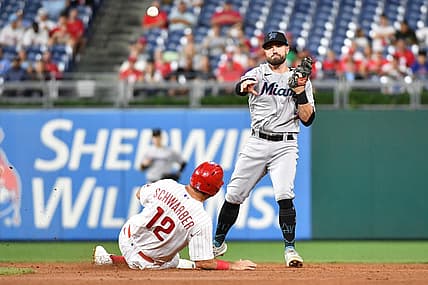 Sep 6, 2022; Philadelphia, Pennsylvania, USA; Philadelphia Phillies left fielder Kyle Schwarber (12) is forced out at second base by Miami Marlins third baseman Jon Berti (5) during the third inning at Citizens Bank Park. Mandatory Credit: Eric Hartline-USA TODAY Sports