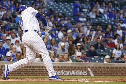 Sep 6, 2022; Chicago, Illinois, USA; Chicago Cubs left fielder Ian Happ (8) hits a solo home run against the Cincinnati Reds during the first inning at Wrigley Field. Mandatory Credit: Kamil Krzaczynski-USA TODAY Sports