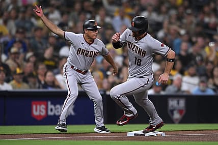Sep 6, 2022; San Diego, California, USA; Arizona Diamondbacks catcher Carson Kelly (18) is waved home by third base coach Tony Perezchica (left) on a double hit by shortstop Sergio Alcantara (not pictured) during the fourth inning against the San Diego Padres at Petco Park. Mandatory Credit: Orlando Ramirez-USA TODAY Sports