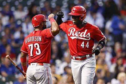 Sep 7, 2022; Chicago, Illinois, USA; Cincinnati Reds right fielder Aristides Aquino (44) celebrates with catcher Chuckie Robinson (73) after hitting a solo home run against the Chicago Cubs during the third inning at Wrigley Field. Mandatory Credit: Kamil Krzaczynski-USA TODAY Sports
