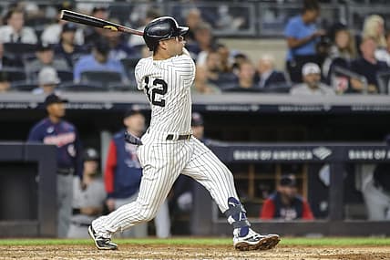 Sep 7, 2022; Bronx, New York, USA;  New York Yankees third baseman Isiah Kiner-Falefa (12) hits a grand slam home run in the fourth inning against the Minnesota Twins at Yankee Stadium. Mandatory Credit: Wendell Cruz-USA TODAY Sports