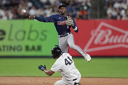 Sep 8, 2022; Bronx, New York, USA; Minnesota Twins left fielder Nick Gordon (1) throws to first base to complete a double play as New York Yankees designated hitter Miguel Andujar (41) slides during the fourth inning at Yankee Stadium. Mandatory Credit: Vincent Carchietta-USA TODAY Sports