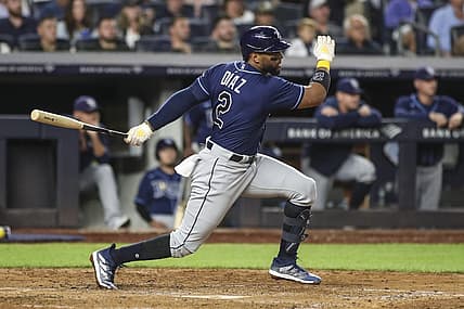 Sep 9, 2022; Bronx, New York, USA;  Tampa Bay Rays third baseman Yandy Diaz (2) hits a single in the fourth inning against the New York Yankees at Yankee Stadium. Mandatory Credit: Wendell Cruz-USA TODAY Sports