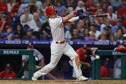 Sep 9, 2022; Philadelphia, Pennsylvania, USA; Philadelphia Phillies third baseman Dalton Guthrie (18) hits an RBI infield single during the seventh inning against the Washington Nationals at Citizens Bank Park. Mandatory Credit: Bill Streicher-USA TODAY Sports