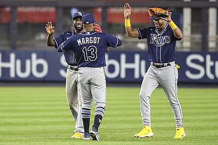 Sep 9, 2022; Bronx, New York, USA;  Tampa Bay Rays outfielders Randy Arozarena (56), Manuel Margot (13) and  Jose Siri (22) celebrate after defeating the New York Yankees 4-2 at Yankee Stadium. Mandatory Credit: Wendell Cruz-USA TODAY Sports
