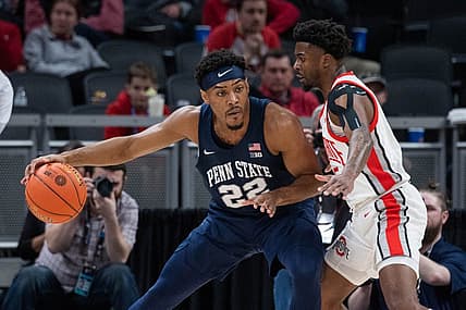 Mar 10, 2022; Indianapolis, IN, USA; Penn State Nittany Lions guard Jalen Pickett (22) dribbles the ball while Ohio State Buckeyes guard Jamari Wheeler (55) defends in the first half at Gainbridge Fieldhouse. Mandatory Credit: Trevor Ruszkowski-USA TODAY Sports