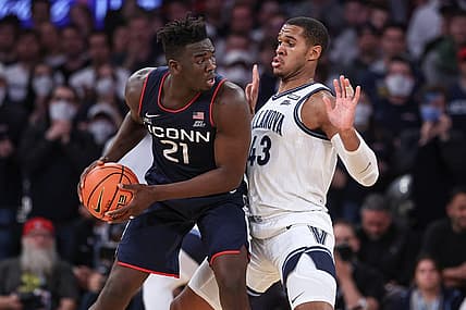 Mar 11, 2022; New York, NY, USA; Connecticut Huskies forward Adama Sanogo (21) controls the ball against Villanova Wildcats forward Eric Dixon (43) during the second half at Madison Square Garden. Mandatory Credit: Vincent Carchietta-USA TODAY Sports