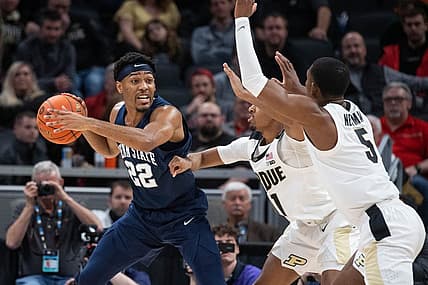 Mar 11, 2022; Indianapolis, IN, USA; Penn State Nittany Lions guard Jalen Pickett (22) looks to pass the ball while Purdue Boilermakers players defend in the second half at Gainbridge Fieldhouse. Mandatory Credit: Trevor Ruszkowski-USA TODAY Sports