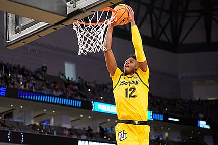Mar 17, 2022; Fort Worth, TX, USA; Marquette Golden Eagles forward Olivier-Maxence Prosper (12) shoots the ball against the North Carolina Tar Heels during the second half during the first round of the 2022 NCAA Tournament at Dickies Arena. Mandatory Credit: Chris Jones-USA TODAY Sports
