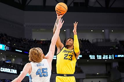 Mar 17, 2022; Fort Worth, TX, USA; Marquette Golden Eagles forward David Joplin (23) shoots the ball over North Carolina Tar Heels forward Brady Manek (45) during the second half during the first round of the 2022 NCAA Tournament at Dickies Arena. North Carolina Tar Heels won 95-63. Mandatory Credit: Chris Jones-USA TODAY Sports