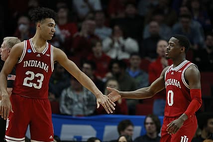 Mar 17, 2022; Portland, OR, USA; Indiana Hoosiers forward Trayce Jackson-Davis (23) and guard Xavier Johnson (0) high-five against the Saint Mary's Gaels during the first half during the first round of the 2022 NCAA Tournament at Moda Center. Mandatory Credit: Soobum Im-USA TODAY Sports
