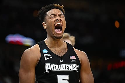 Mar 25, 2022; Chicago, IL, USA; Providence Friars forward Ed Croswell (5) reacts after making a basket while being fouled during the second half against the Kansas Jayhawks in the semifinals of the Midwest regional of the men's college basketball NCAA Tournament at United Center. Mandatory Credit: Jamie Sabau-USA TODAY Sports