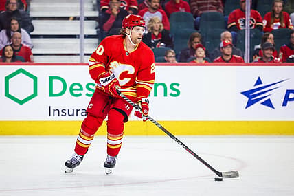 Oct 22, 2022; Calgary, Alberta, CAN; Calgary Flames center Blake Coleman (20) controls the puck against the Carolina Hurricanes during the first period at Scotiabank Saddledome. Mandatory Credit: Sergei Belski-USA TODAY Sports