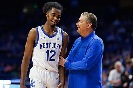 Nov 3, 2022; Lexington, Kentucky, USA; Kentucky Wildcats guard Antonio Reeves (12) talks with head coach John Calipari during the second half against the Kentucky State Thoroughbreds at Rupp Arena at Central Bank Center. Mandatory Credit: Jordan Prather-USA TODAY Sports