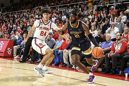 Nov 7, 2022; Queens, New York, USA;   of Merrimack Warriors guard Ziggy Reid (23) drives past St. John's Red Storm guard Rafael Pinzon (24) in the first half at Carnesecca Arena. Mandatory Credit: Wendell Cruz-USA TODAY Sports