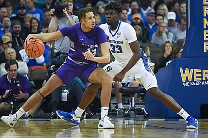 Nov 7, 2022; Omaha, Nebraska, USA;  St. Thomas - Minnesota Tommies forward Ahjany Lee (13) drives against Creighton Bluejays center Fredrick King (33) during the first half at CHI Health Center Omaha. Mandatory Credit: Steven Branscombe-USA TODAY Sports
