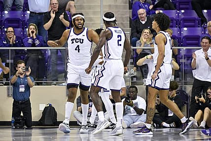 Nov 7, 2022; Fort Worth, Texas, USA; TCU Horned Frogs center Eddie Lampkin Jr. (4) and forward Emanuel Miller (2) celebrate during the second half against the Arkansas-Pine Bluff Golden Lions at Ed and Rae Schollmaier Arena. Mandatory Credit: Jerome Miron-USA TODAY Sports