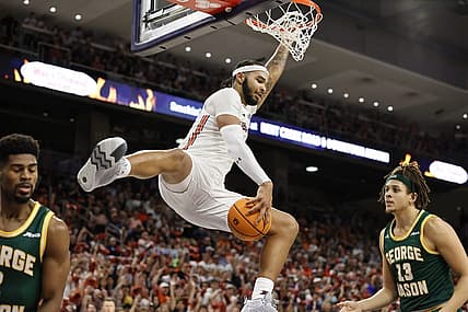 Nov 7, 2022; Auburn, Alabama, USA;  Auburn Tigers forward Johni Broome (4) catches the ball after making a dunk against the George Mason Patriots during the second half at Neville Arena. Mandatory Credit: John Reed-USA TODAY Sports