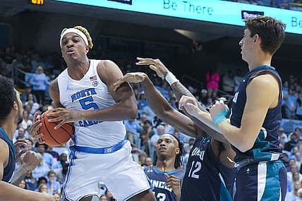 Nov 7, 2022; Chapel Hill, North Carolina, USA;  North Carolina Tar Heels forward Armando Bacot (5) grabs a rebound against the North Carolina-Wilmington Seahawks during the second half at Dean E. Smith Center. Mandatory Credit: James Guillory-USA TODAY Sports