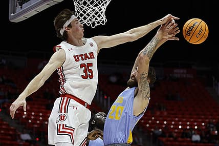 Nov 7, 2022; Salt Lake City, Utah, USA;  Utah Utes center Branden Carlson (35) and LIU Sharks forward Jake Cook (20) battle for the ball in the first half at Jon M. Huntsman Center. Mandatory Credit: Jeffrey Swinger-USA TODAY Sports