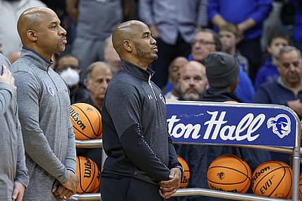 Nov 9, 2022; Newark, New Jersey, USA; Seton Hall Pirates head coach Shaheen Holloway (right) stands during the national anthem before the game against the Monmouth Hawks at Prudential Center. Mandatory Credit: Vincent Carchietta-USA TODAY Sports