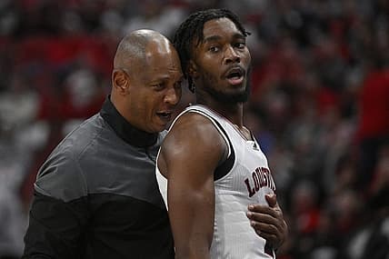 Nov 9, 2022; Louisville, Kentucky, USA;  Louisville Cardinals head coach Kenny Payne talks with forward Roosevelt Wheeler (4) during the second half against the Bellarmine Knights at KFC Yum! Center. Bellarmine defeated Louisville 67-66. Mandatory Credit: Jamie Rhodes-USA TODAY Sports